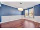 Dining room with hardwood floors, wainscoting, and a modern chandelier at 136 Stagecoach Ln, Summerville, SC 29483