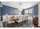 Dining room with a large table and seating for six, featuring a modern chandelier at 136 Stagecoach Ln, Summerville, SC 29483