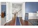 Elegant foyer with hardwood floors, wainscoting, and an open view to the staircase and living areas at 136 Stagecoach Ln, Summerville, SC 29483