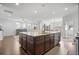 View of kitchen island, living room, and dining area; open-concept layout at 136 Stagecoach Ln, Summerville, SC 29483