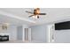 Open-concept living area with fireplace, ceiling fan, large doorways, and a neutral color scheme throughout at 136 Stagecoach Ln, Summerville, SC 29483