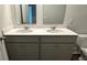 Bathroom featuring double sink vanity with gray cabinets and quartz countertops at 137 Haventree Ct, Summerville, SC 29486