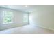 Bedroom with a large window with blinds and neutral carpet at 137 Haventree Ct, Summerville, SC 29486