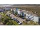 Aerial view of the community buildings and boat storage area, set along a waterfront at 138 W Mariners Cay Dr, Folly Beach, SC 29439