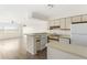 Cozy kitchen that flows into the adjacent living area and large window with water views at 138 W Mariners Cay Dr, Folly Beach, SC 29439