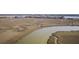 Scenic aerial view of marshy land with coastal community in the background, offering picturesque views and a peaceful setting at 138 W Mariners Cay Dr, Folly Beach, SC 29439