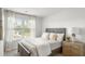 Comfortable bedroom with neutral walls, bed with pillows, and bedside table at 139 Haventree Ct, Summerville, SC 29486