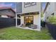 Cozy backyard patio with outdoor seating and sliding glass doors to the living area at 14 F St # B, Charleston, SC 29403