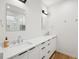 Elegant bathroom featuring double sinks, quartz counters, and sleek black hardware at 14 F St # B, Charleston, SC 29403