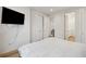 Clean bedroom with hardwood floors, double door closet, and adjacent bathroom at 14 F St # B, Charleston, SC 29403