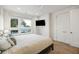 Sunlit bedroom featuring a ceiling fan and a large window with neighborhood views at 14 F St # B, Charleston, SC 29403