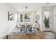 Bright dining area with a modern table, stylish chairs, contemporary light fixture, and hardwood floors at 14 F St # B, Charleston, SC 29403