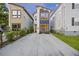 Charming two-story home with modern design, a long driveway, and manicured landscaping at 14 F St # B, Charleston, SC 29403