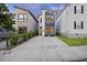 Modern two-story home with a concrete driveway and contemporary architectural design at 14 F St # B, Charleston, SC 29403