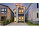 Modern home featuring unique design, multiple windows, a concrete driveway, and stylish exterior lighting at 14 F St # B, Charleston, SC 29403