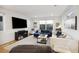 Spacious living room features natural light, hardwood floors, comfortable seating and entertainment center at 14 F St # B, Charleston, SC 29403