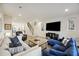 Inviting living room with plush seating, hardwood floors, and a staircase to the second level at 14 F St # B, Charleston, SC 29403