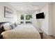 Bright main bedroom with large windows, hardwood floors, ceiling fan and TV at 14 F St # B, Charleston, SC 29403