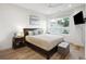 Stylish bedroom featuring a ceiling fan, natural light, and hardwood floors at 14 F St # B, Charleston, SC 29403