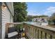 Outdoor balcony with a seating area overlooking community pool, trees, and landscaping at 1402 Camp Rd # 9G, Charleston, SC 29412