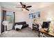 Bedroom with neutral-toned walls, carpeted floors, a ceiling fan, and window bringing natural light at 1402 Camp Rd # 9G, Charleston, SC 29412