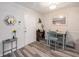 A clean and simple dining area featuring light-colored walls, natural light, and minimalistic decor at 1402 Camp Rd # 9G, Charleston, SC 29412