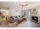 A cozy living room featuring a fireplace, plush seating, and lots of natural light at 1402 Camp Rd # 9G, Charleston, SC 29412