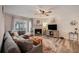 A bright living room featuring a fireplace, stylish decor, and an inviting atmosphere at 1402 Camp Rd # 9G, Charleston, SC 29412