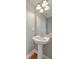 Bathroom featuring a pedestal sink, modern fixtures, and ample lighting at 1408 Bimini Dr, Charleston, SC 29414