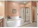 Bathroom featuring tub and shower, and peach-colored walls at 1408 Bimini Dr, Charleston, SC 29414