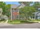 A cozy brick home with black shutters and a beautiful tree in the front yard at 1408 Bimini Dr, Charleston, SC 29414