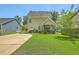 Back exterior of the house with a manicured lawn, showcasing an inviting outdoor space at 1408 Bimini Dr, Charleston, SC 29414