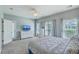 This spacious bedroom features natural light, neutral walls, carpet, and outside access at 1408 Bimini Dr, Charleston, SC 29414