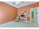An office featuring orange-colored walls, carpet, and ceiling fan at 1408 Bimini Dr, Charleston, SC 29414