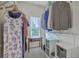 Well-organized walk-in closet with ample storage space, shelving, and a window for natural light at 1408 Bimini Dr, Charleston, SC 29414