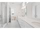 Bright primary bathroom with a double sink vanity, quartz countertops and a glass enclosed shower at 141 Summerwind Dr, Summerville, SC 29483
