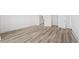 Bedroom boasts lots of natural light and beautiful laminate flooring, connecting to en suite bathroom at 141 Summerwind Dr, Summerville, SC 29483