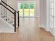 Spacious living room area with beautiful hardwood flooring and sliding doors leading to the backyard at 141 Summerwind Dr, Summerville, SC 29483