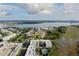 Stunning aerial view of community with waterfront, marsh views and a bridge in the background on a partially cloudy day at 145 Pier View St # 407, Charleston, SC 29492