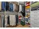 Well-organized walk-in closet with custom shelving and hanging rods, providing ample storage space at 145 Pier View St # 407, Charleston, SC 29492