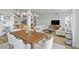 Open-concept dining room featuring neutral colors, modern lighting, and seamless integration with the living area at 145 Pier View St # 407, Charleston, SC 29492