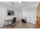 Well-lit home office featuring laminate floors, modern desk, and neutral walls for a bright workspace at 145 Pier View St # 407, Charleston, SC 29492