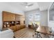 Well-lit home office featuring custom built-ins, modern desk, and large window for natural light, providing a productive workspace at 145 Pier View St # 407, Charleston, SC 29492