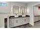 Bathroom featuring double vanity, modern black fixtures, bright lighting, and glass enclosed shower at 1543 Scott Hill Rd, James Island, SC 29412