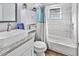 Stylish bathroom with a marble tiled walls, modern vanity, and combined shower and tub at 1543 Scott Hill Rd, James Island, SC 29412