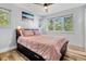 Comfortable bedroom features hardwood floors, soft lighting, and calming decor at 1543 Scott Hill Rd, James Island, SC 29412