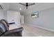 Cozy bedroom with plush carpeting, ample closet space, ceiling fan, and mounted tv at 1543 Scott Hill Rd, James Island, SC 29412