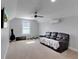 Spacious bedroom with plush carpeting, ceiling fan, mounted television and a large window at 1543 Scott Hill Rd, James Island, SC 29412