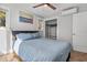 Tranquil bedroom with a plush bed, soft lighting, and a window view of the natural surroundings at 1543 Scott Hill Rd, James Island, SC 29412