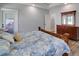 Comfortable bedroom with wood furniture, a floral comforter, and a bright, airy feel at 1543 Scott Hill Rd, James Island, SC 29412